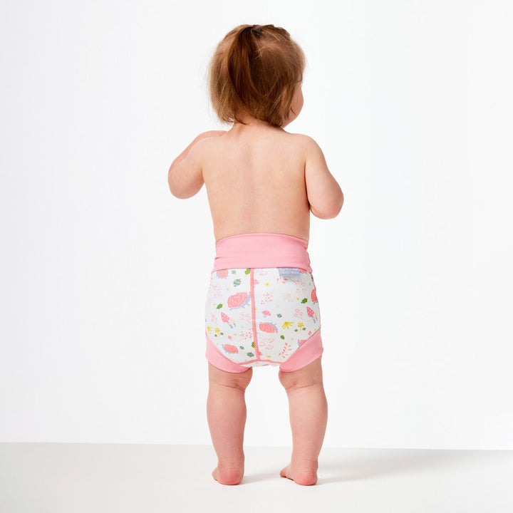 Lifestyle image of little one wearing swim nappy, back.