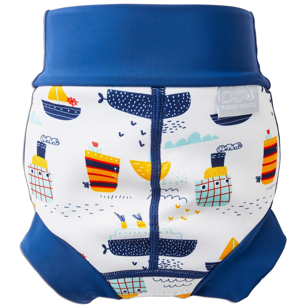 Reusable swim nappy in white with navy blue ribs and boats themed print. Back.