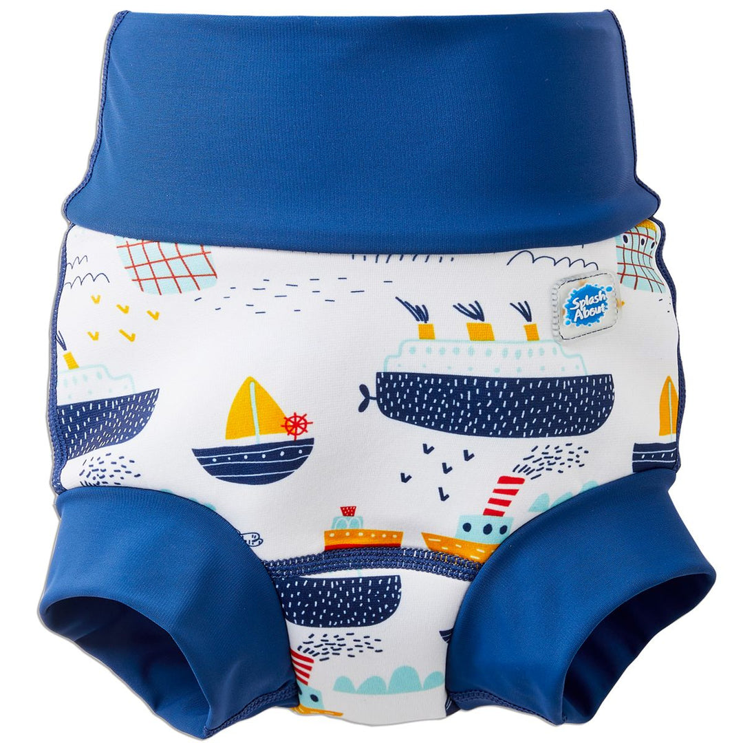 Reusable swim nappy in white with navy blue ribs and boats themed print. Front.