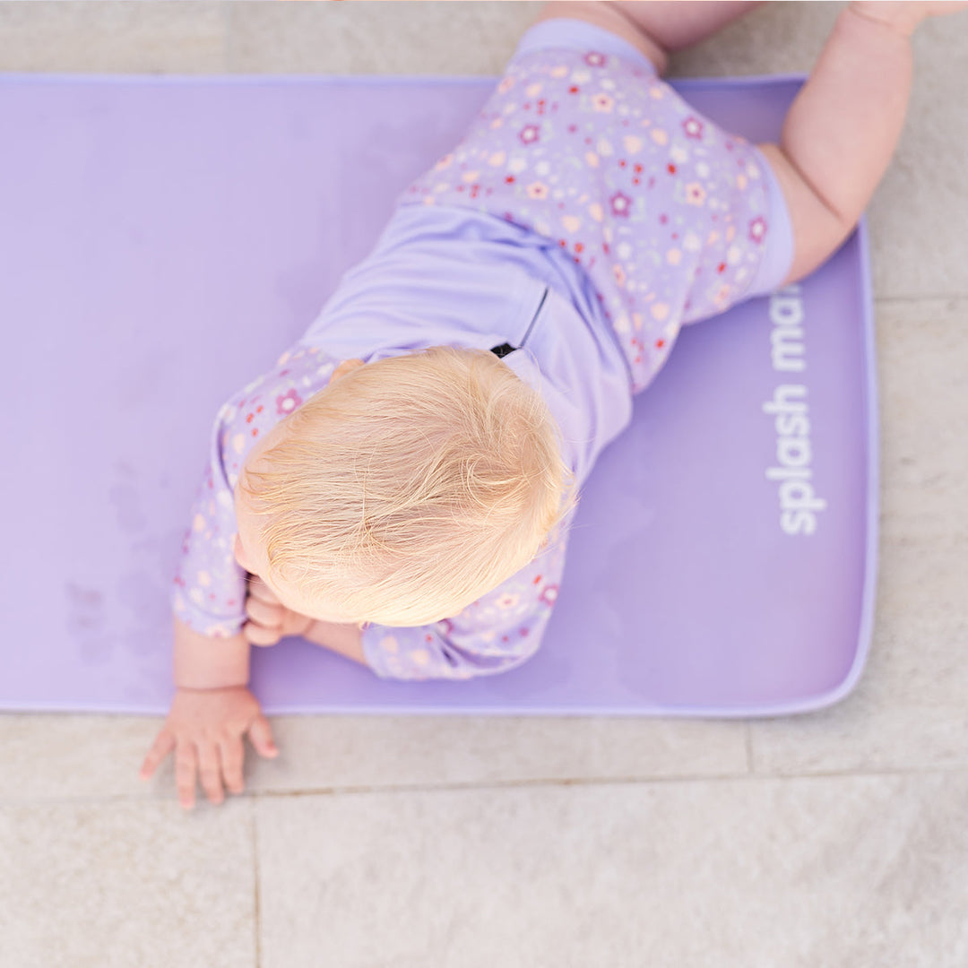 Child on neoprene mat