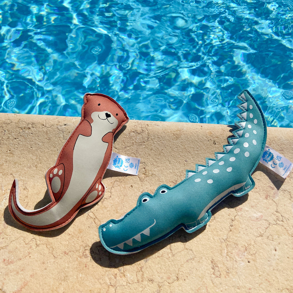 Crocodile and otter themed neoprene toys, poolside