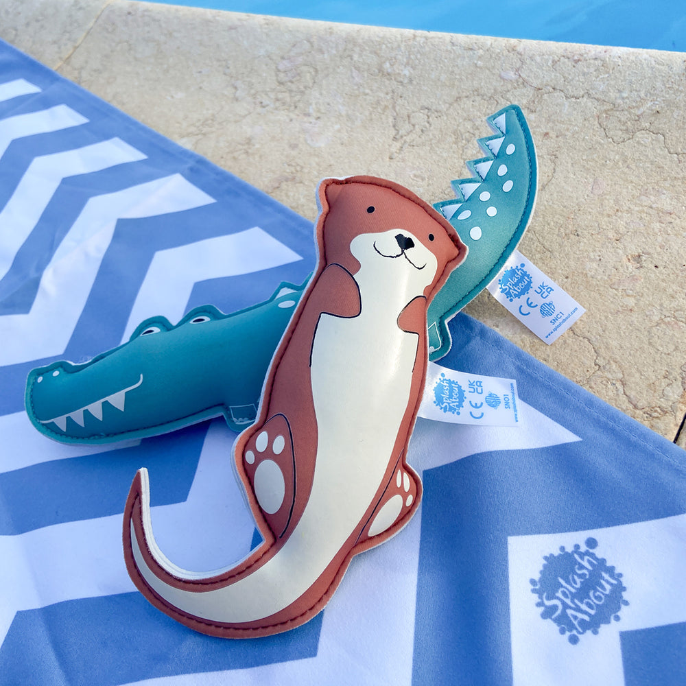 Crocodile and otter themed neoprene toys, poolside