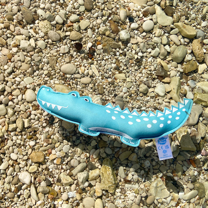 Crocodile themed neoprene toy, floating in the river