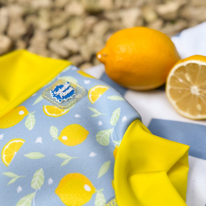 Neoprene swim nappy in blue, with yellow ribs and lemons themed print.