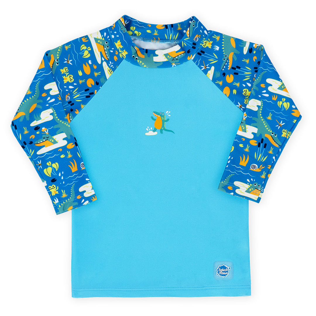 UV protective long sleeve rash top in blue, featuring crocodiles and frogs themed print on the chest and sleeves. Front.