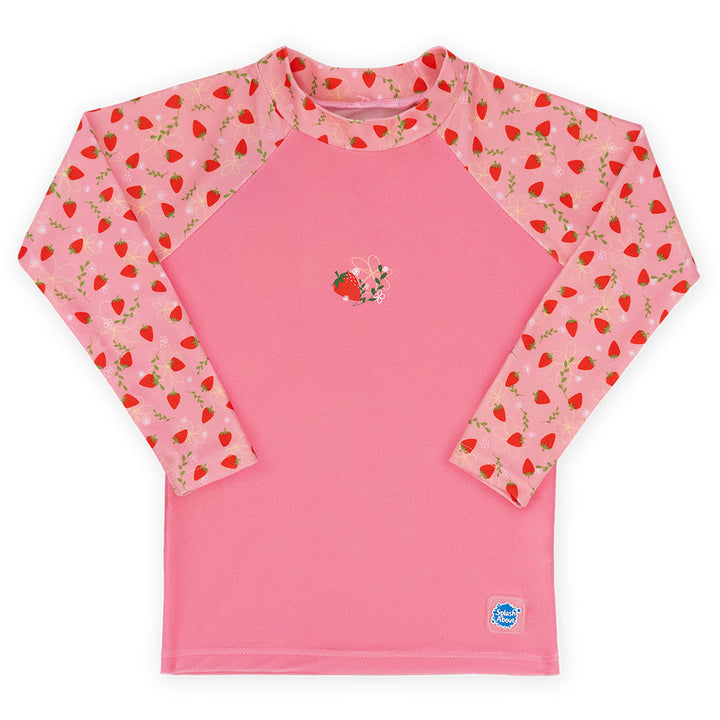 UV protective long sleeve rash top in pink, and strawberries themed print on the chest and sleeves. Front.
