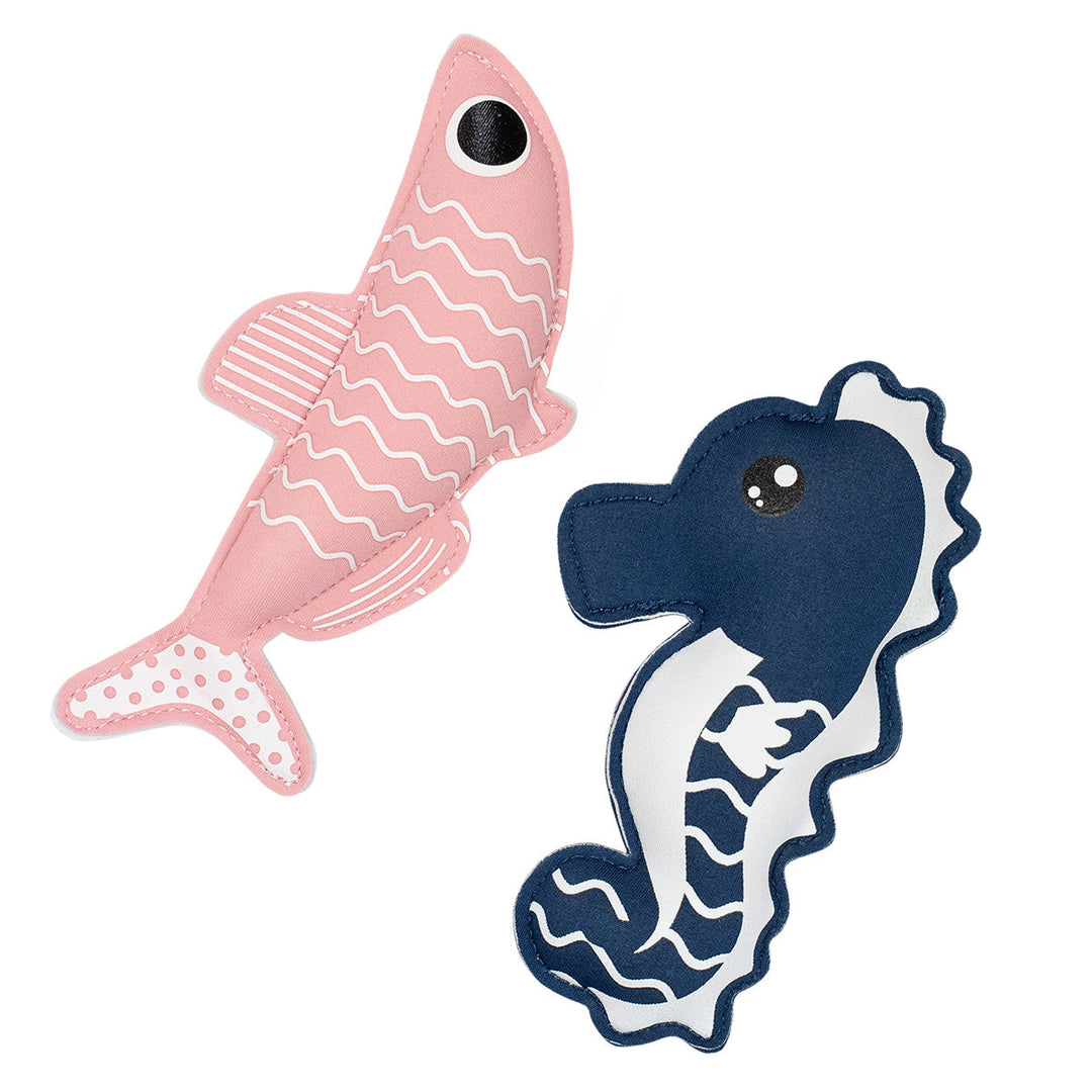 Flat lay image of sardine and seahorse themed neoprene toys, pink and navy side
