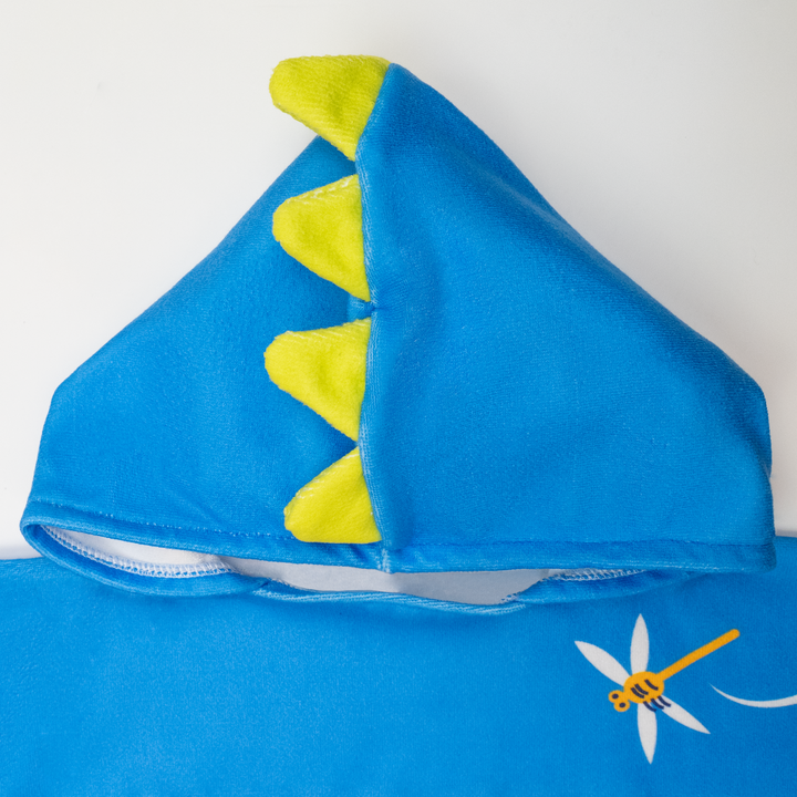 Flat lay image of poncho towel in blue with crocodiles and frogs themed print. Close up of the hood.