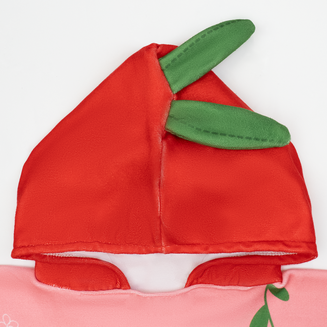Flat lay image of poncho towel in pink and red with strawberries themed print. Close up of the hood.