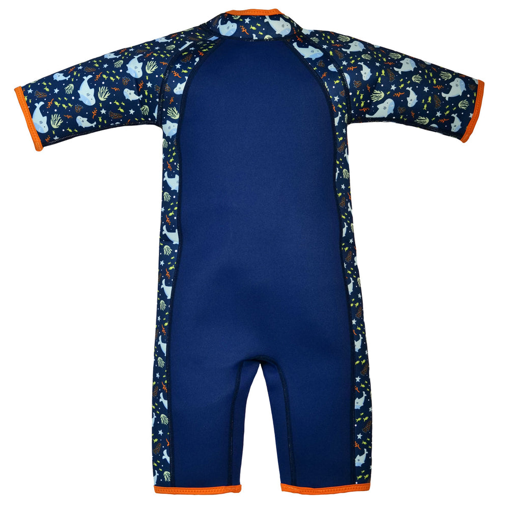 Shorty wetsuit in navy with bright orange trims, featuring sharks and coral themed print in sleeves and side panels. Back.