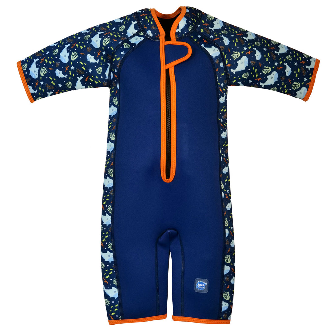 Shorty wetsuit in navy with bright orange trims, featuring sharks and coral themed print in sleeves and side panels. Front.