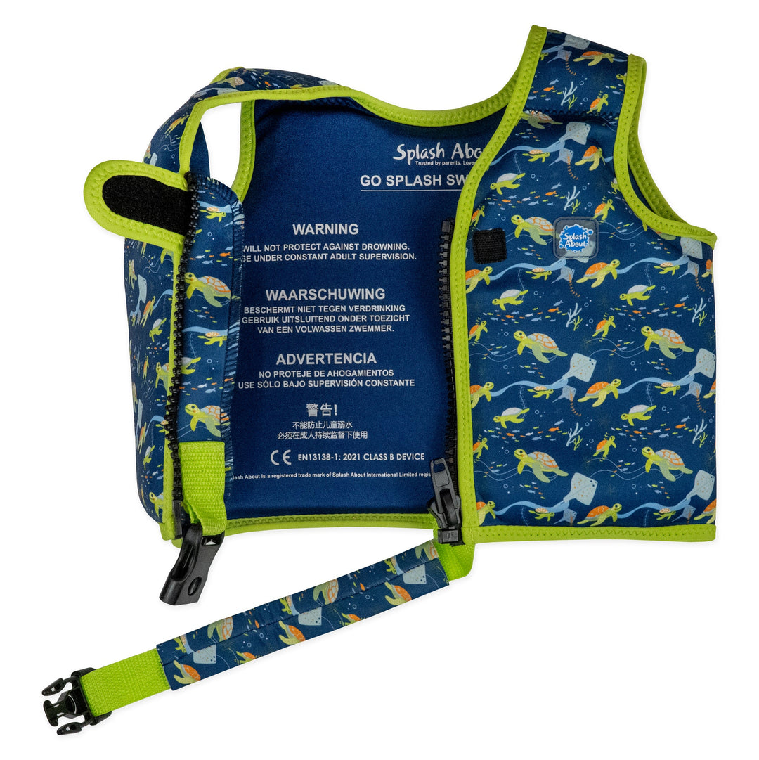 Swim vest for toddlers with non-removable floats in navy, bright green trims, and turtles and mantarays themed print. Inside.
