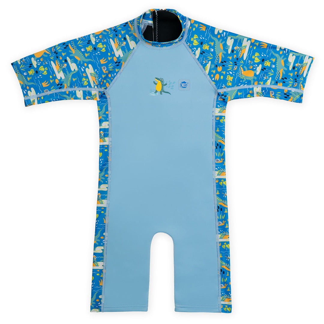 One piece UV sun and sea wetsuit for toddlers in blue, featuring crocodiles and frogs themed print on sleeves, side panels, neck and chest. Front.