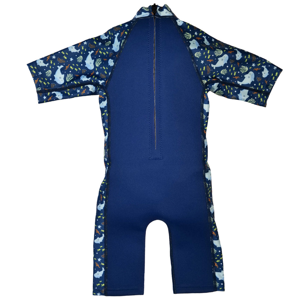 One piece UV sun and sea wetsuit for toddlers in navy blue, featuring sharks, coral and fish themed print on sleeves, side panels, neck and chest. Back.
