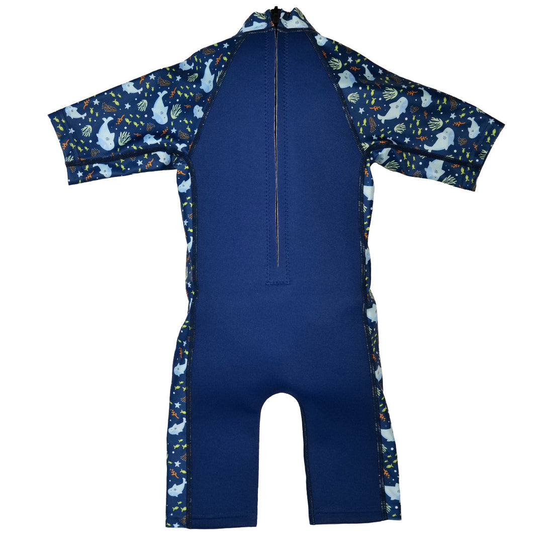 One piece UV sun and sea wetsuit for toddlers in navy blue, featuring sharks, coral and fish themed print on sleeves, side panels, neck and chest. Back.