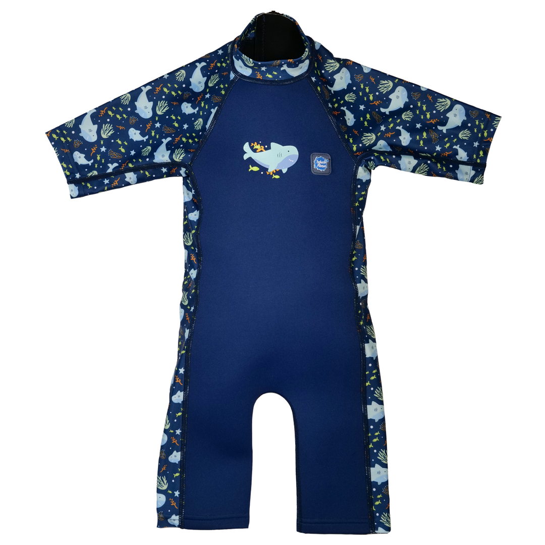 One piece UV sun and sea wetsuit for toddlers in navy blue, featuring sharks, coral and fish themed print on sleeves, side panels, neck and chest. Front.
