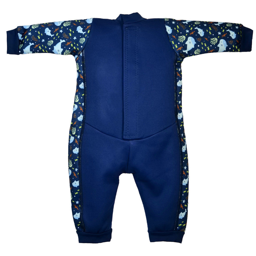 Flat lay image of fleece-lined baby wetsuit in navy with sharks themed print. Back.