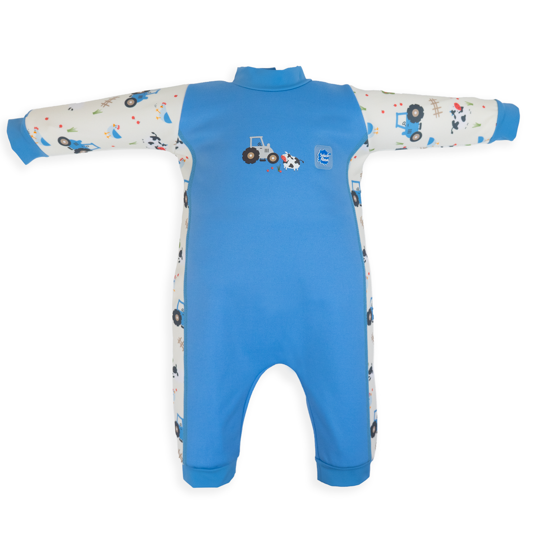 Flat lay image of fleece-lined baby wetsuit in white and blue with farm themed print. Front.
