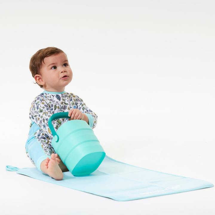 Child on neoprene mat