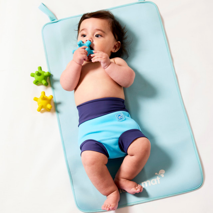 Child on neoprene mat