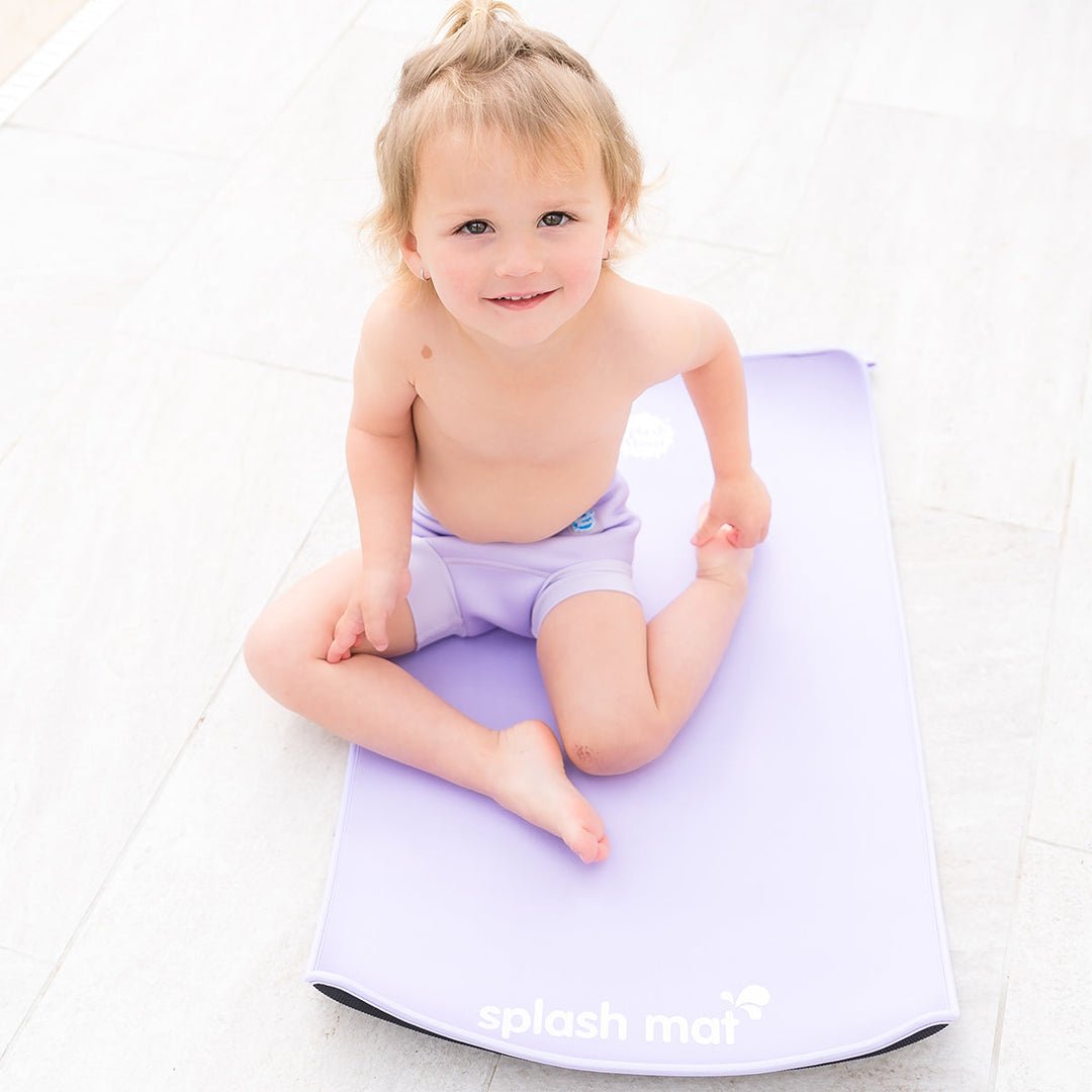 Child on neoprene mat