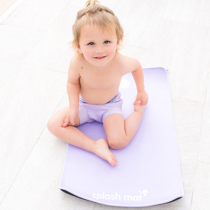 Child on neoprene mat