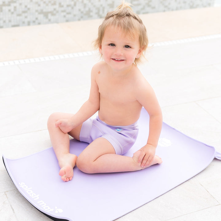 Child on neoprene mat