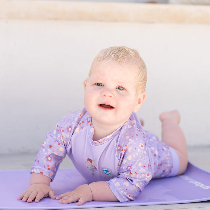 Child on neoprene mat