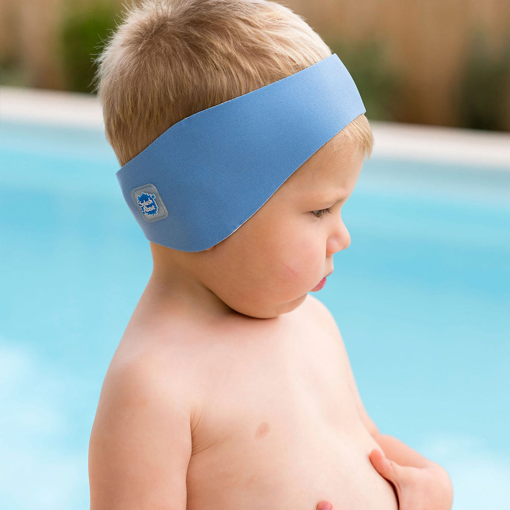 Little one wearing swim ear band in cashmere blue, side