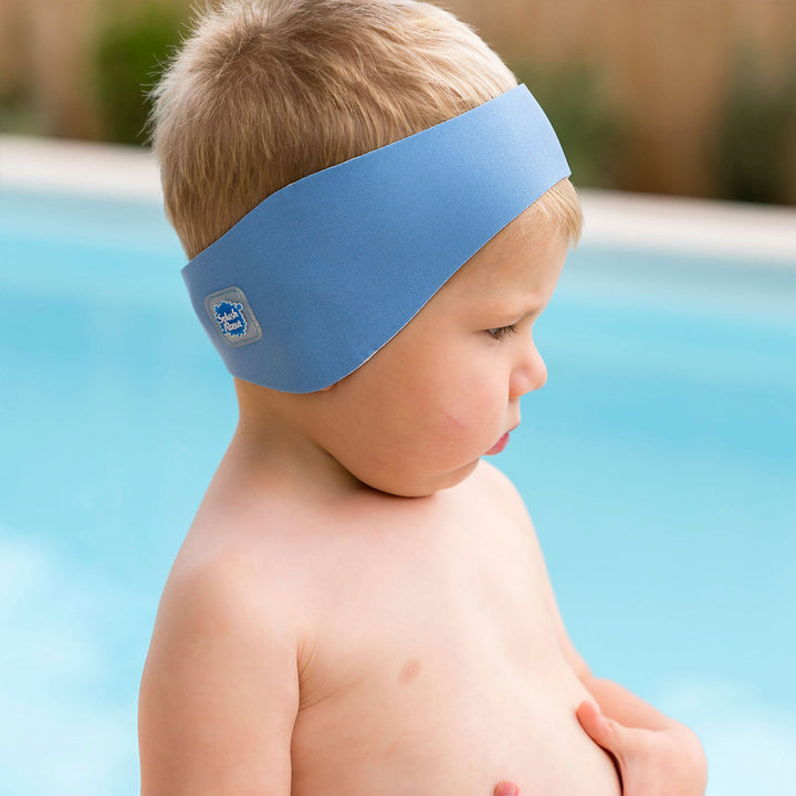 Little one wearing swim ear band in cashmere blue, side