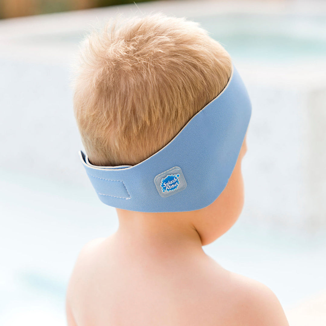 Little one wearing swim ear band in cashmere blue, back