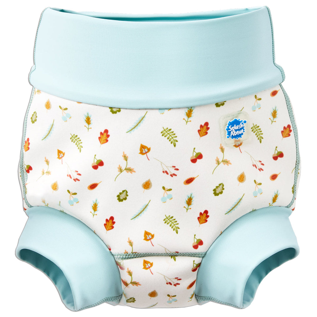 Reusable swim nappy in white with light blue ribs and Autumn themed print. Front.