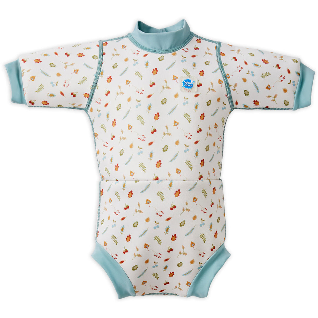 Baby wetsuit with built in swim nappy in white with light blue trims and leaves and acorns themed print. Front.