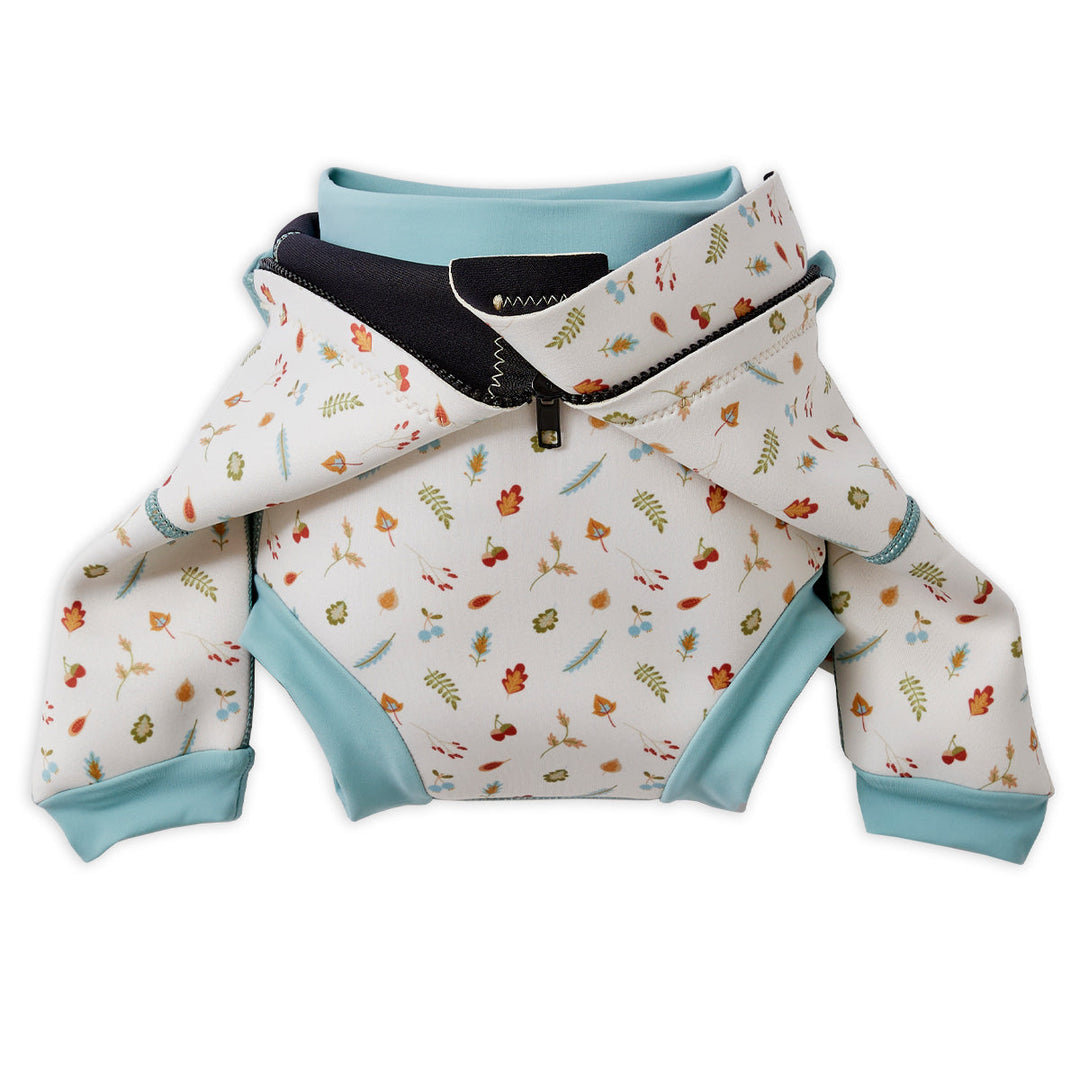 Baby wetsuit with built in swim nappy in white with light blue trims and leaves and acorns themed print. Built-in nappy.