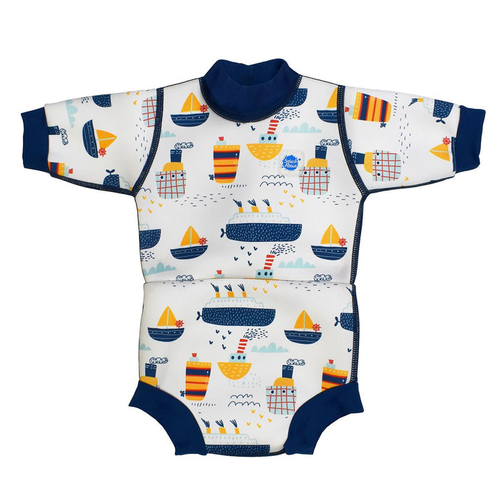 Baby wetsuit with built in swim nappy in white with navy trims and boats themed print. Front.