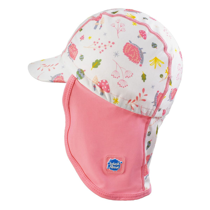 Legionnaire style sun hat in pink and white, with forest themed print panel including hedgehogs, mushrooms and leaves. Side.