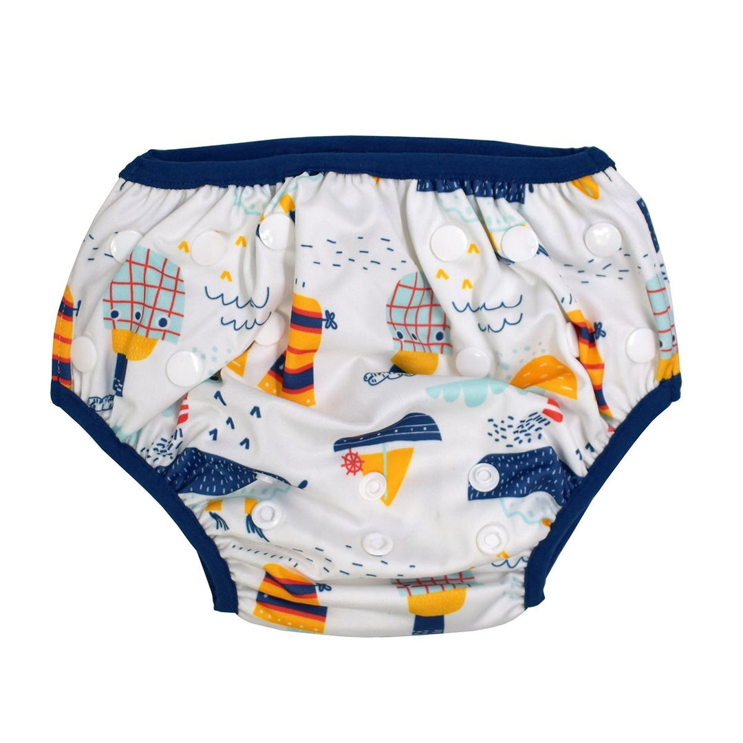 Under nappy in white with navy trims and boats themed print. Size adjustable with poppers. Back.