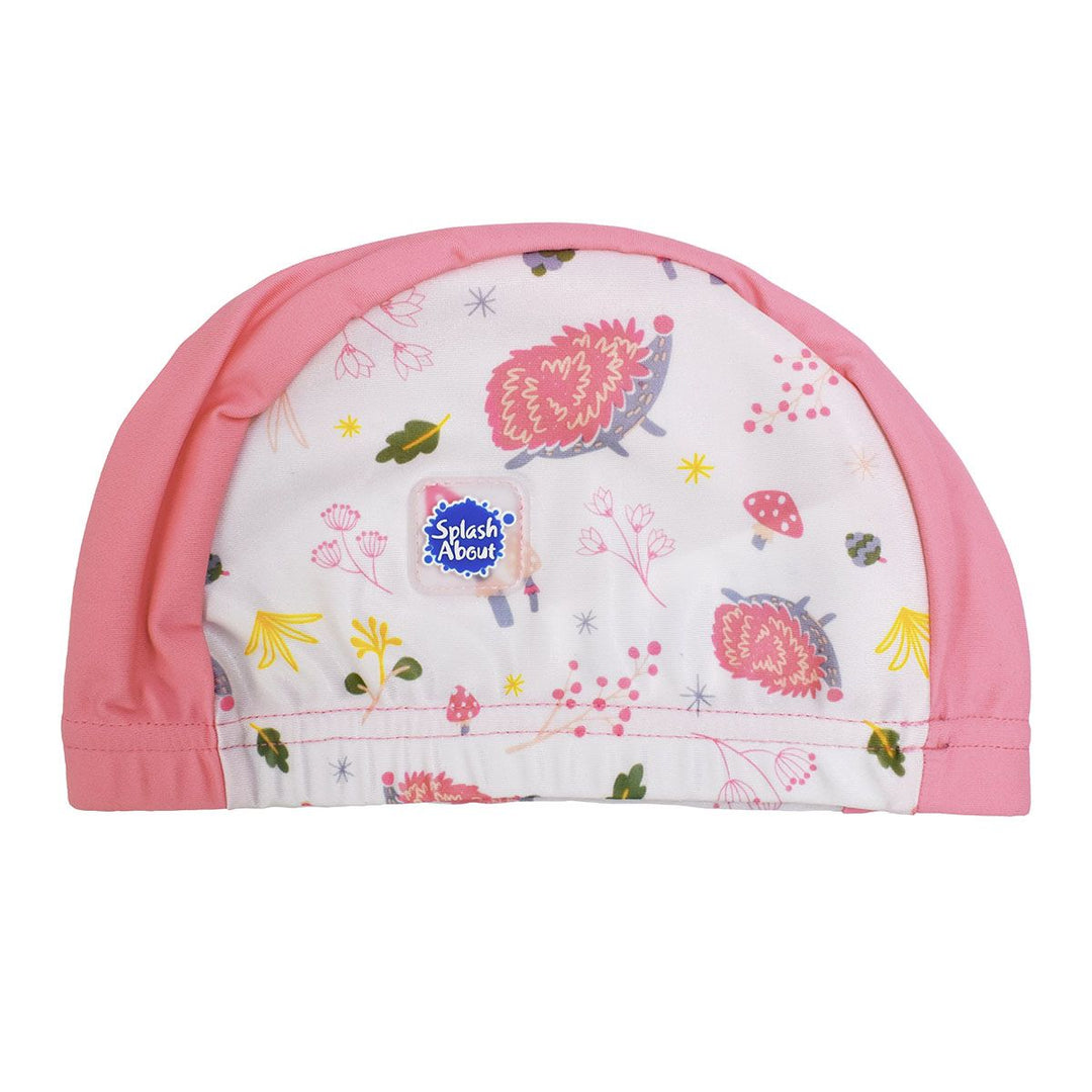 Cute baby swim hat in pink and white with forest themed print, including hedgehogs, mushrooms and leaves.