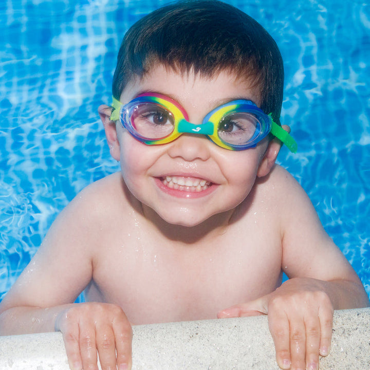 Little one wearing colourful goggles in the pool