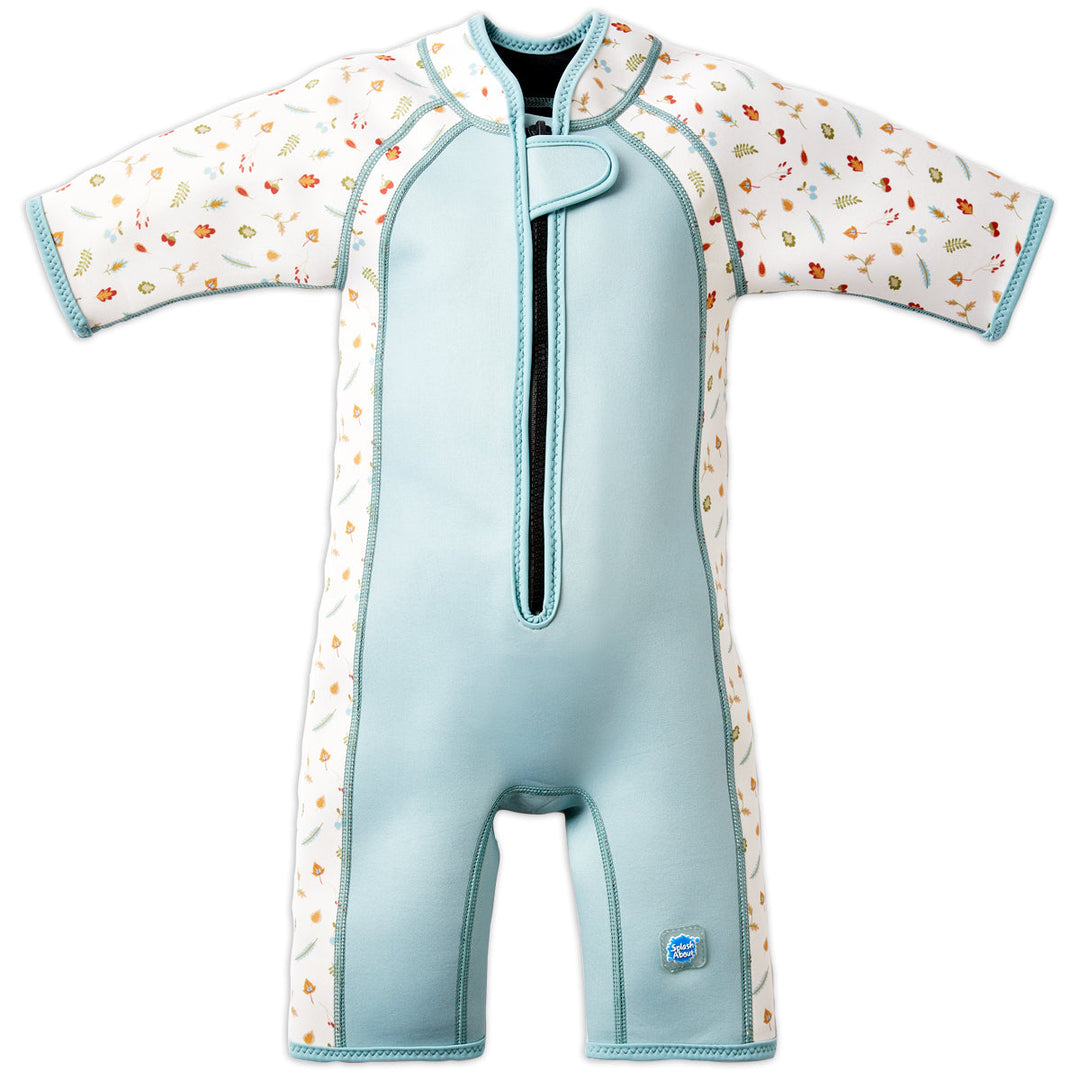 Shorty wetsuit in light blue, featuring acorns and leaves themed print over white background in sleeves and side panels. Front.