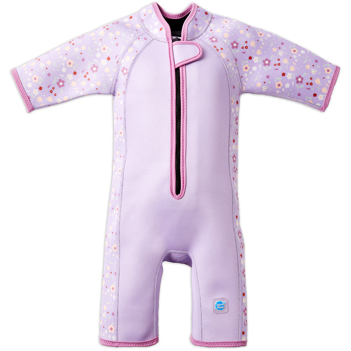 Shorty wetsuit in lilac, featuring floral themed print in sleeves and side panels. Front.