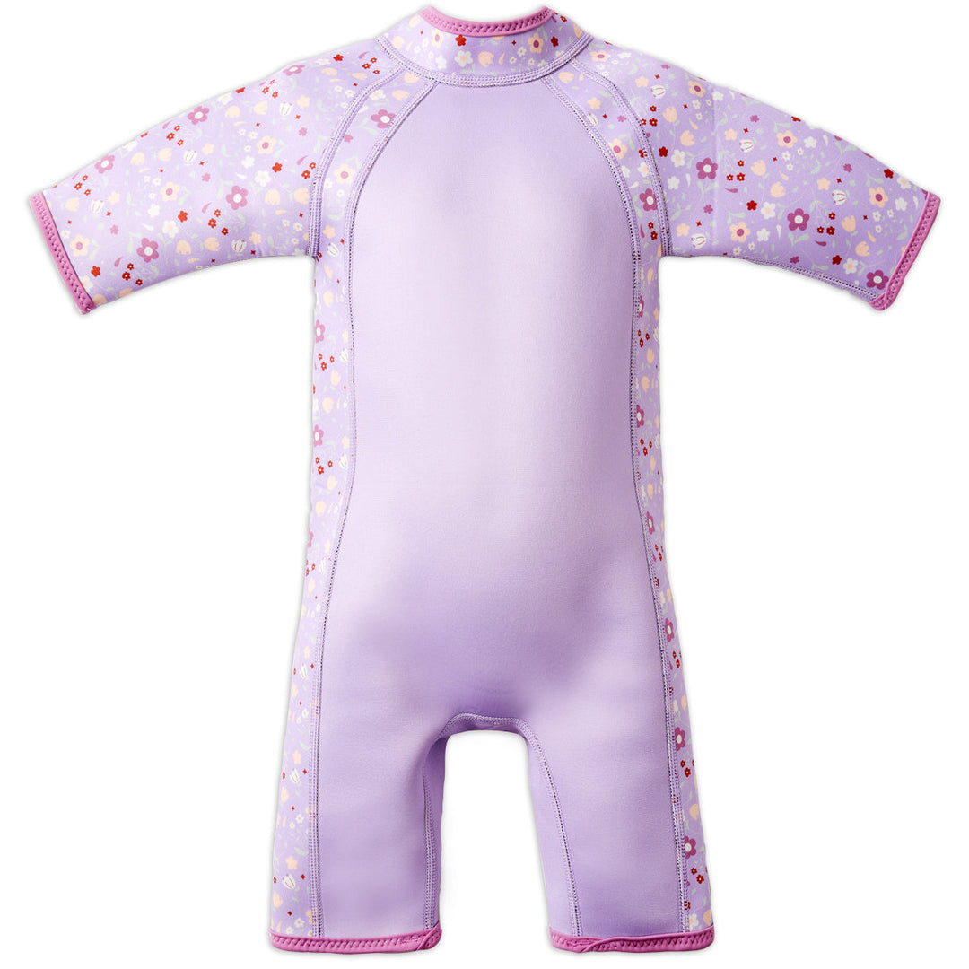 Shorty wetsuit in lilac, featuring floral themed print in sleeves and side panels. Back.