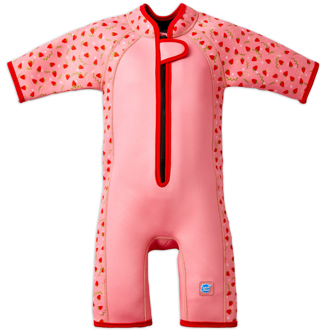 Shorty wetsuit in pink with bright red trims, featuring strawberries themed print in sleeves and side panels. Front.