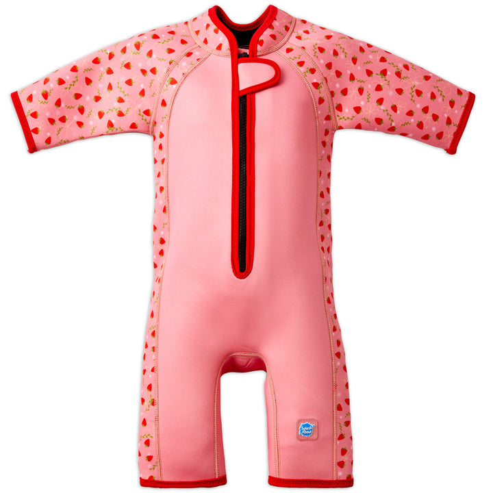 Shorty wetsuit in pink with bright red trims, featuring strawberries themed print in sleeves and side panels. Front.