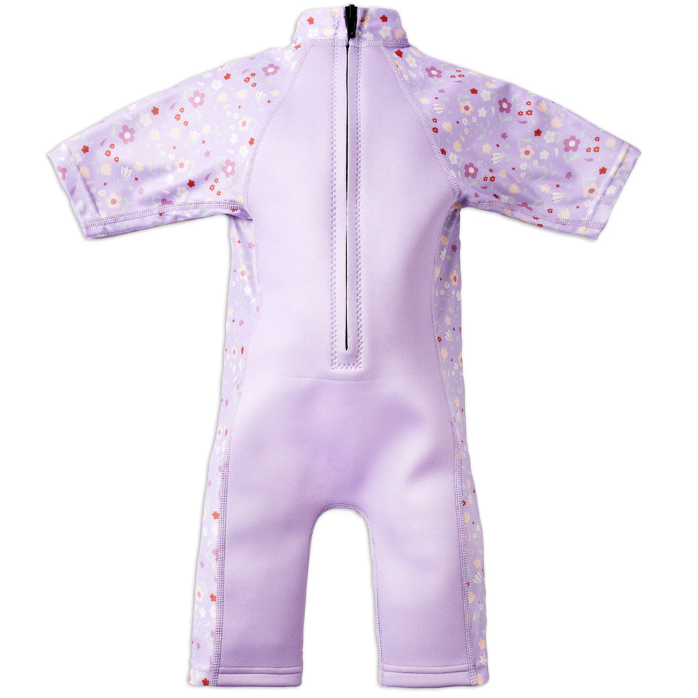 One piece UV sun and sea wetsuit for toddlers in lilac featuring floral print on sleeves, side panels, neck and chest. Back.