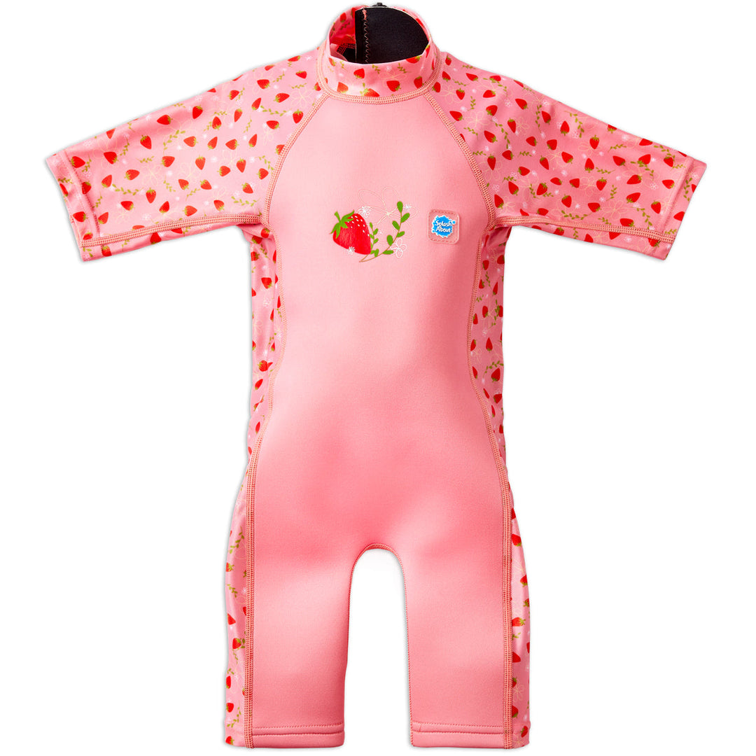 One piece UV sun and sea wetsuit for toddlers in pink, featuring strawberries themed print on sleeves, side panels, neck and chest. Front.