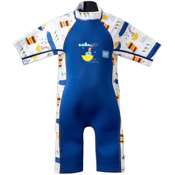 One piece UV sun and sea wetsuit for toddlers in white and navy. Boats themed print on sleeves, side panels, neck and chest. Front.
