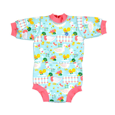 Baby wetsuit with built in swim nappy in pink and blue duck print. Front.