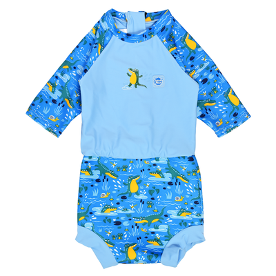 Happy Nappy Sunsuit in blue and swamp themed print, including crocodiles, snails, fireflies, frogs and more. Front.