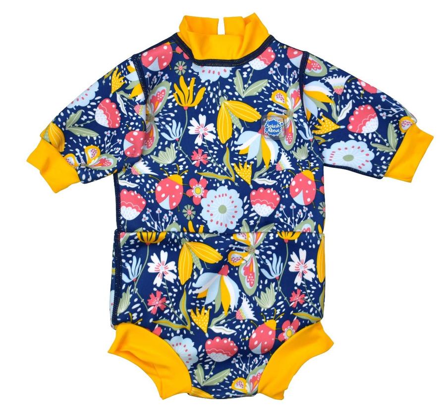 Baby wetsuit with built in swim nappy in navy blue and floral print. Yellow trims. Front.